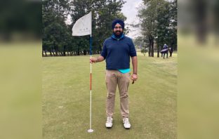 Pukhraj Singh Brar posing after acing the par-4 17th at CGC