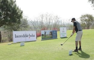 Golfer tees off at the 10th for the Indian Terrain Straightest drive contest