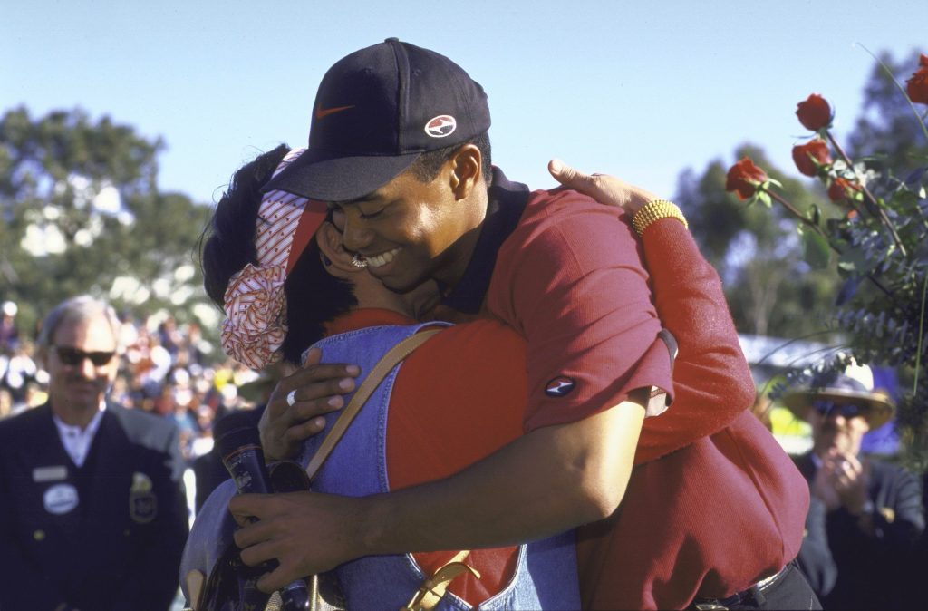 An emotional Tiger Woods hugging his mother