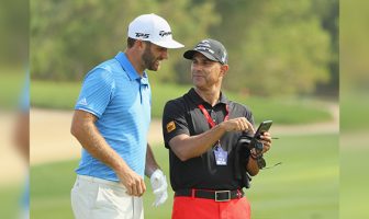 Dustin Johnson with Claude Harmon III | Photo: Golf Digest